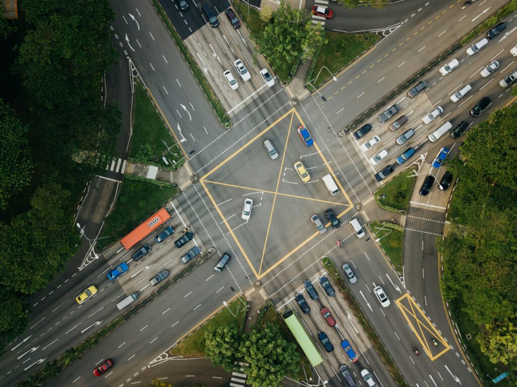 Busy city intersection with traffic lights and vehicles