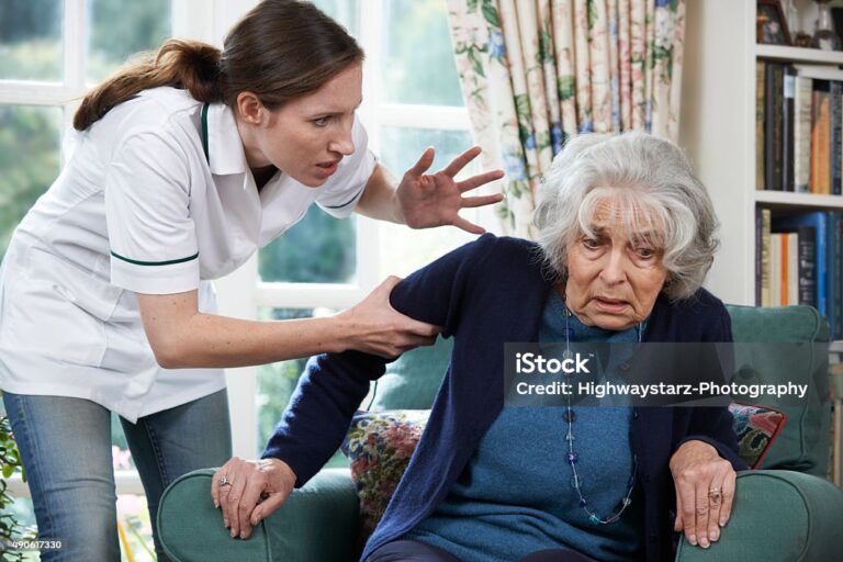 Care Worker Mistreating Senior Woman At Home