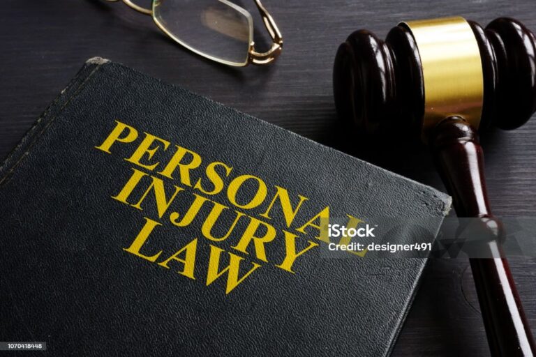 Personal Injury Law book and a black desk